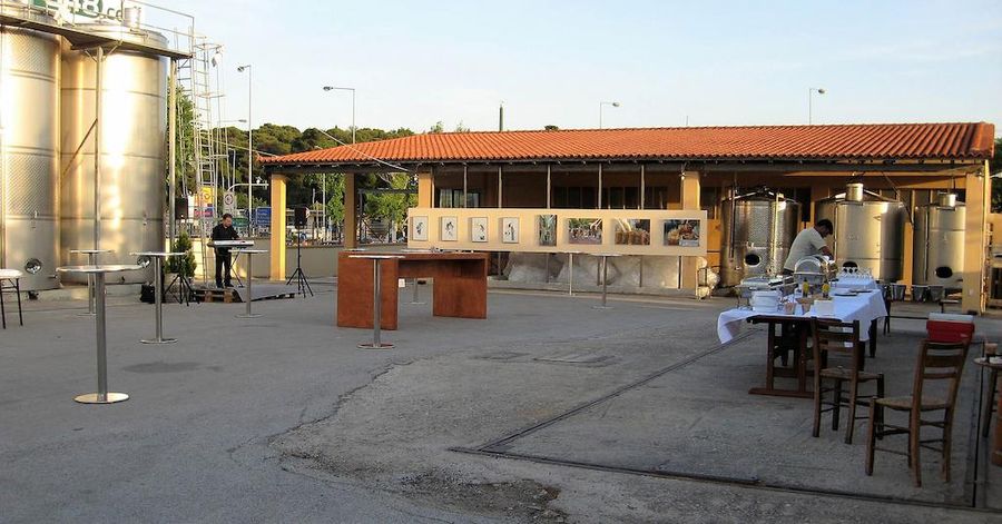 outside at Papagiannis Winery premises, table for tasting wine